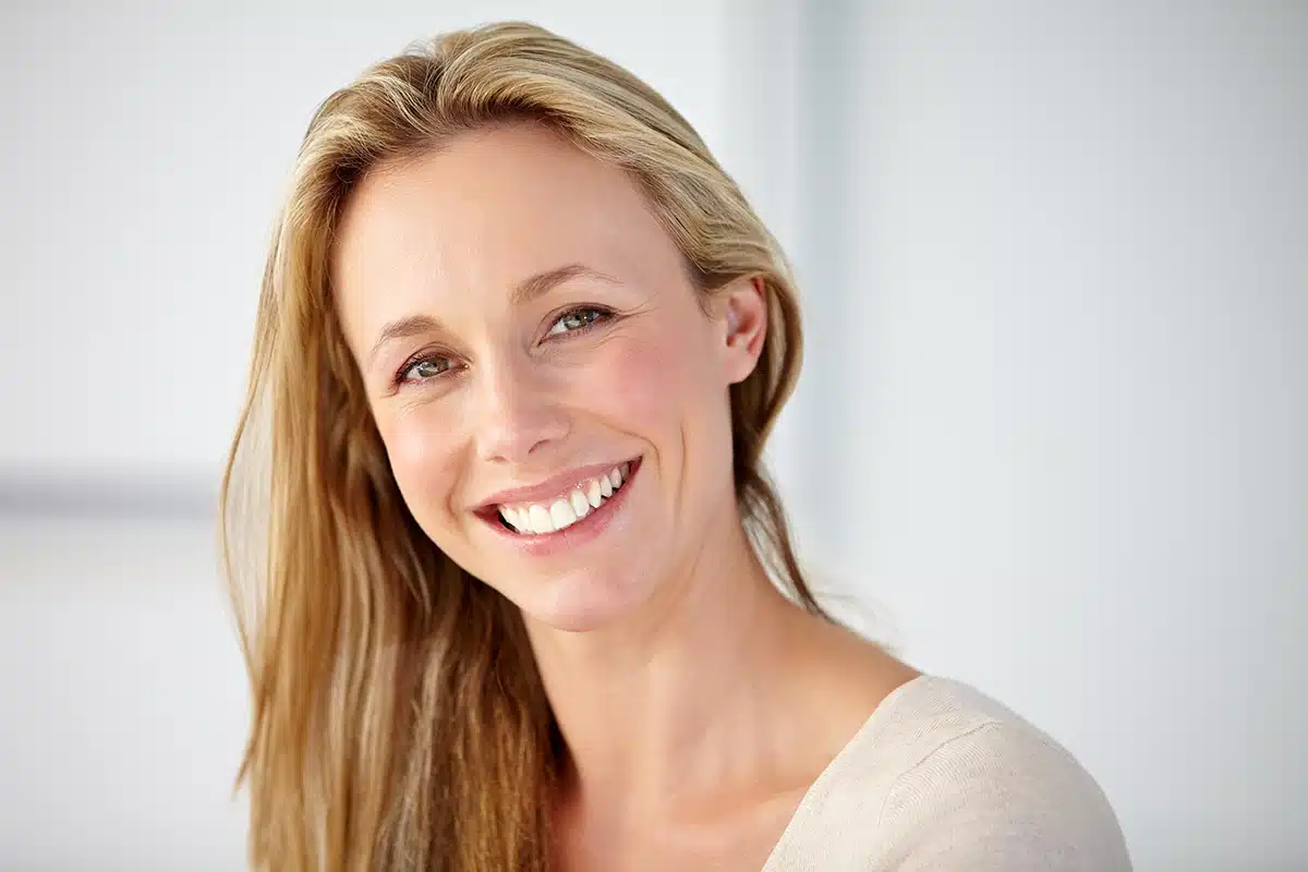 happy portrait and mature woman in home with confident personality