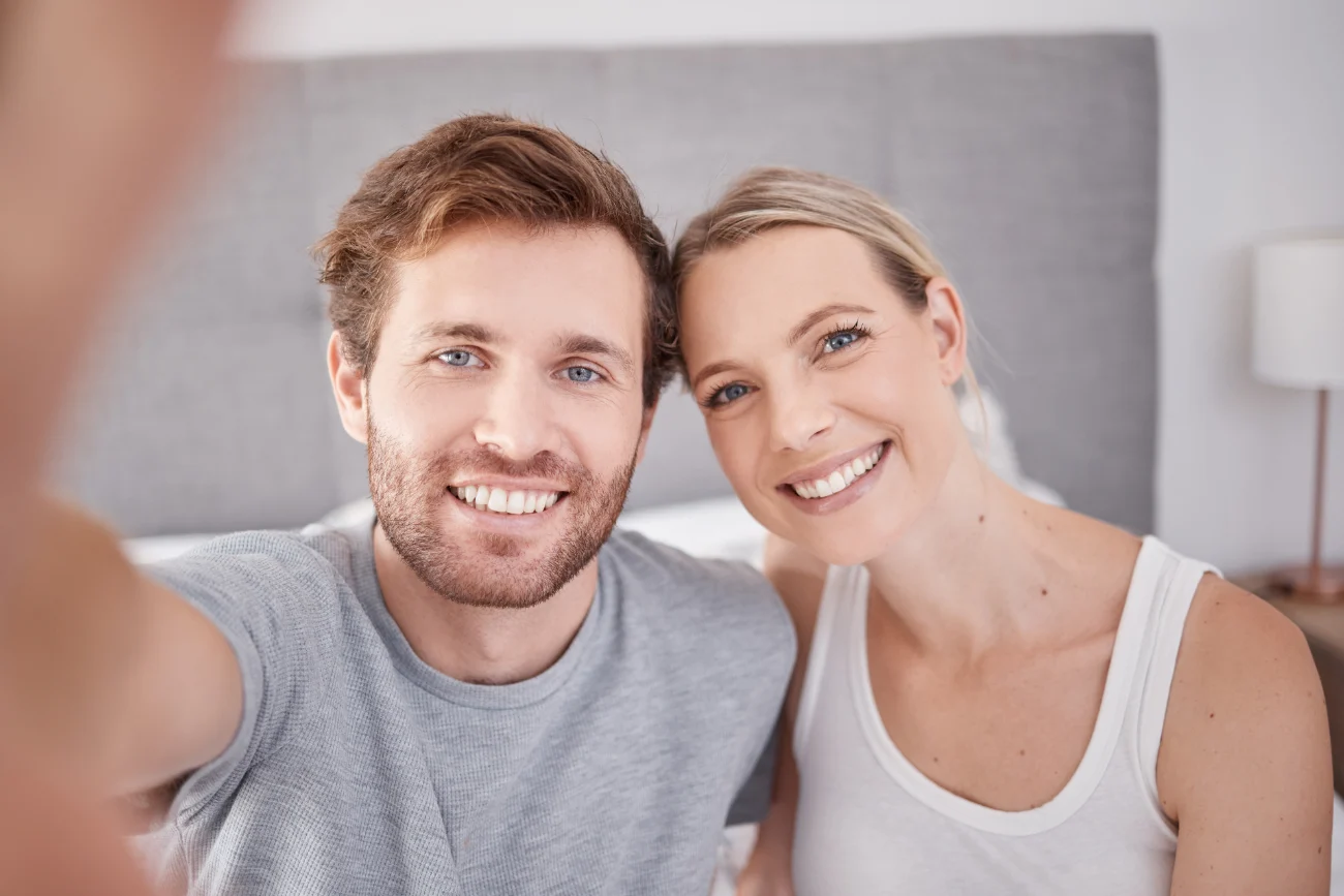 male and female side by side happy
