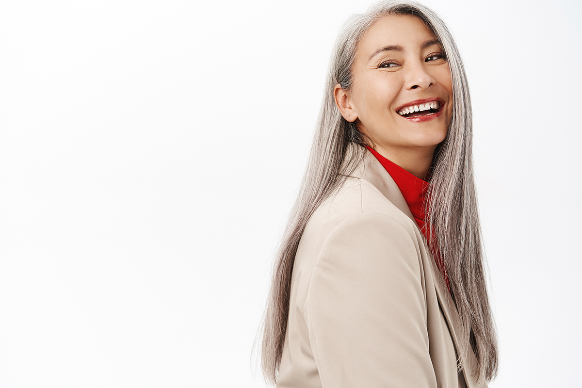 portrait of healthy and happy senior woman with long grey hair