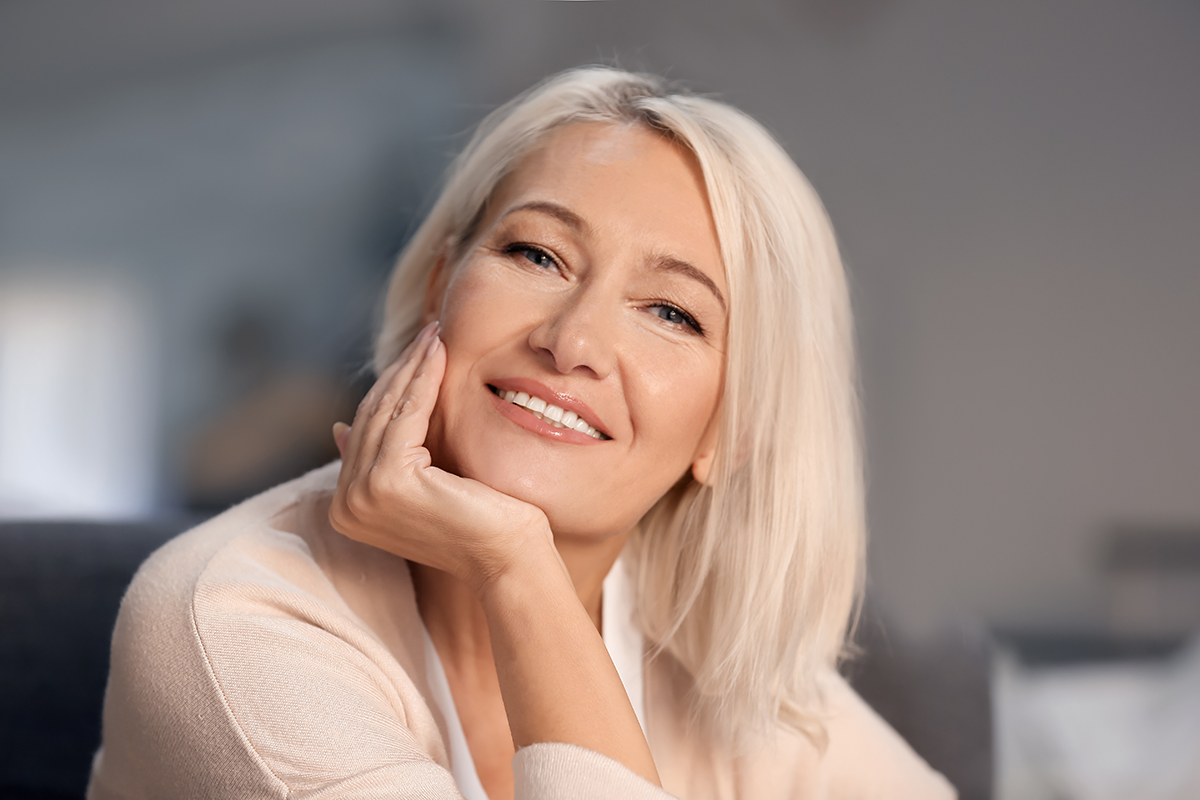 portrait of smiling mature woman at home