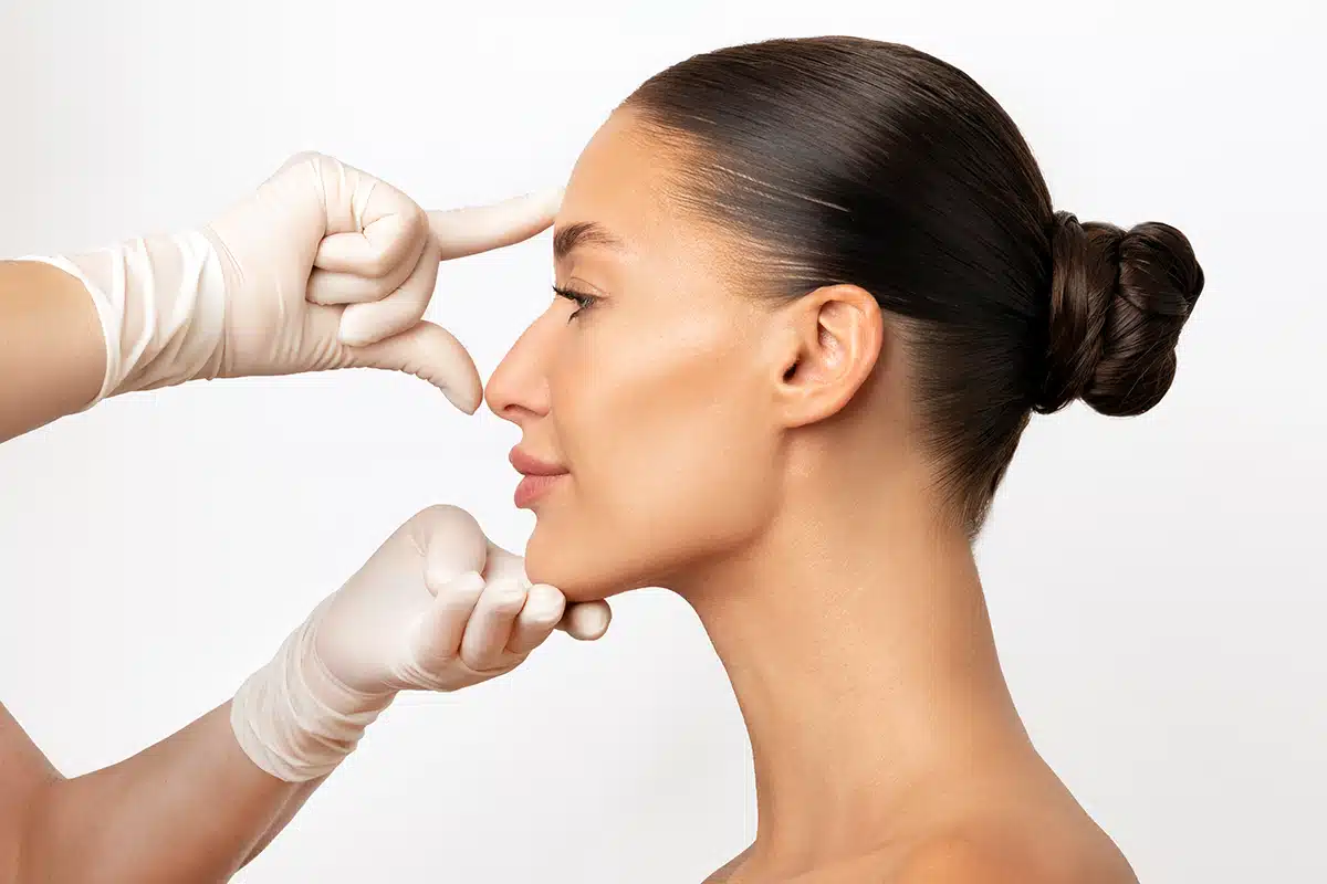 profile shot of woman consulting before rhinoplasty operation