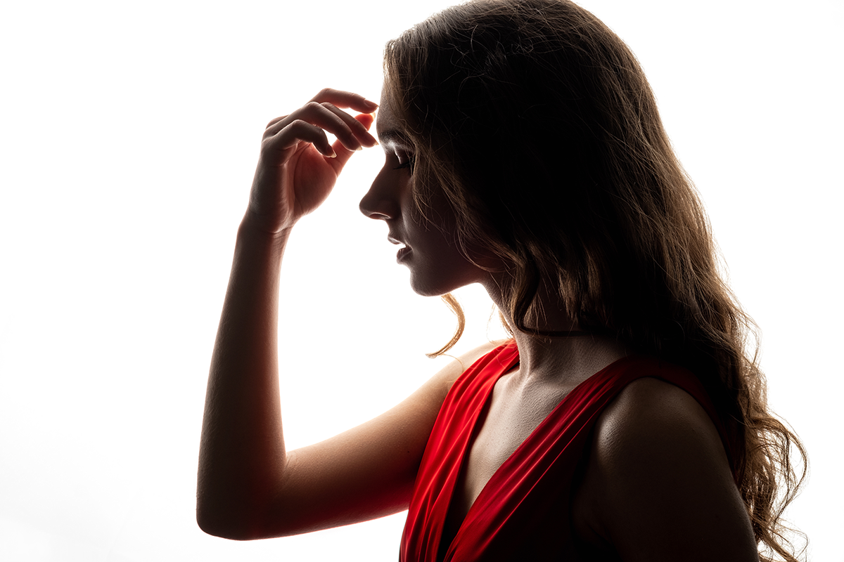 silhouette of peaceful brunette woman