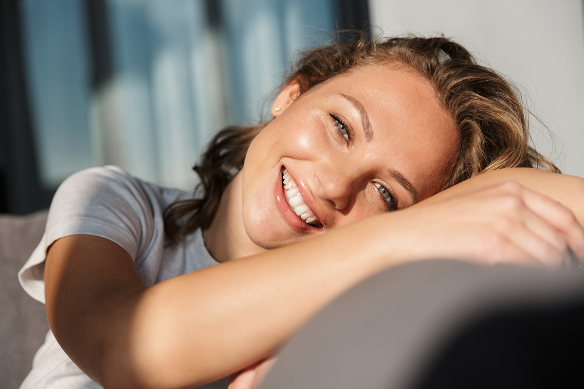 smiling pretty blonde young woman wearing casual clothes