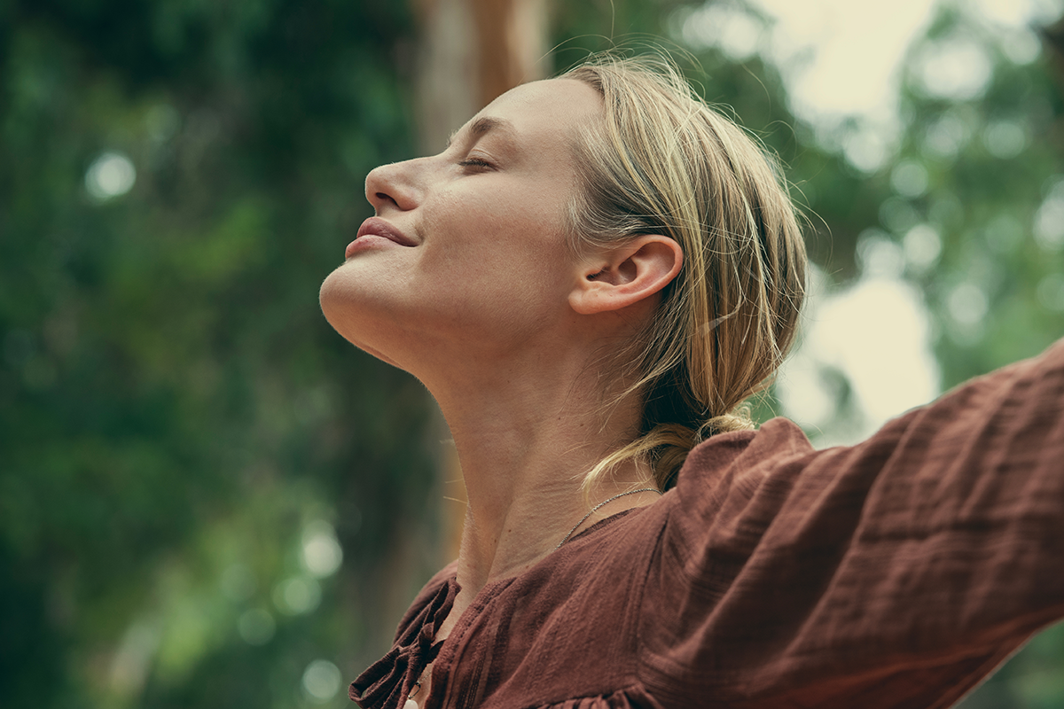 woman breathing fresh air outdoor