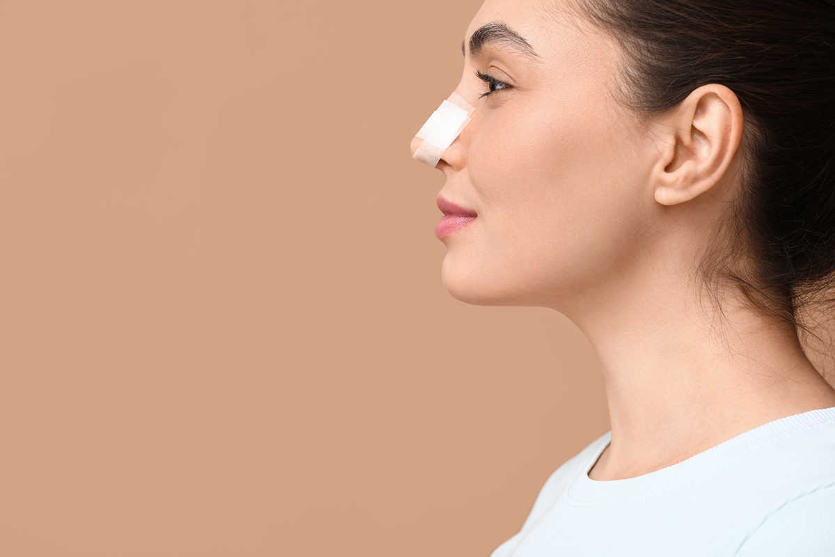 young woman with bandaged nose
