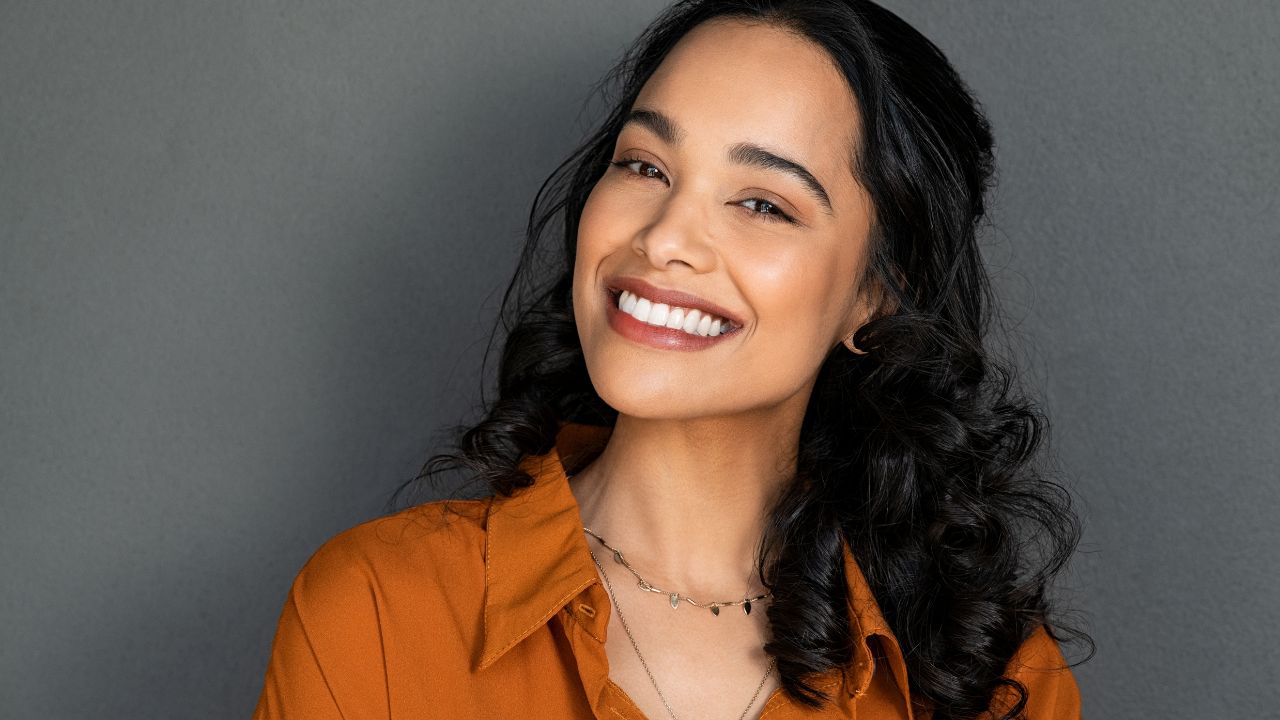 Happy latin beautiful woman smiling