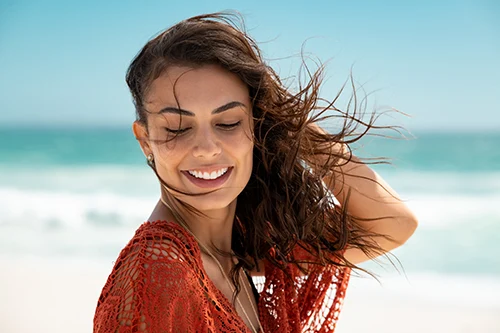 beautiful happy young woman on beach